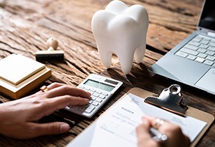 A patient calculating their dental insurance benefits