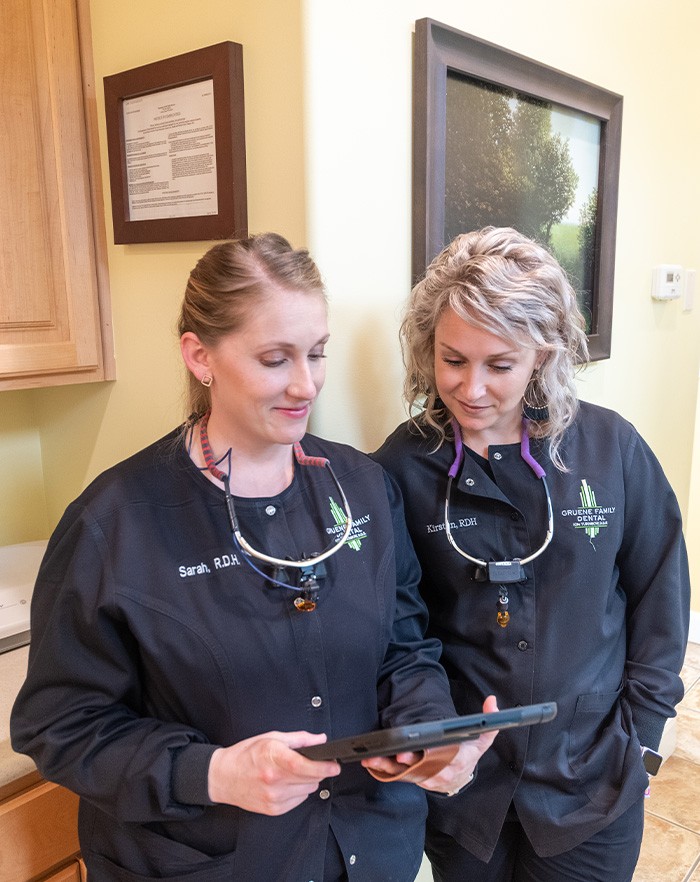 Two team members looking at tablet computer