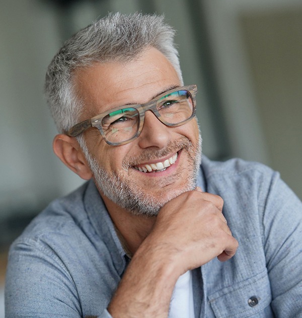 a man smiling with a dental bridge in New Braunfels