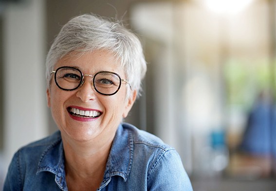 a woman smiling with a dental bridge in New Braunfels