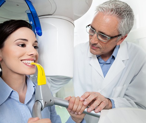 Female patient in CBCT machine, prepared for scan