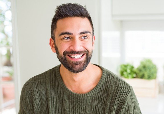 Man sharing smile after metal-free dental restoration placement