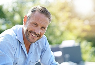 man smiling after choosing the right cosmetic treatment for him