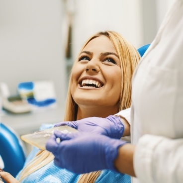 Woman laughing during dental checkup