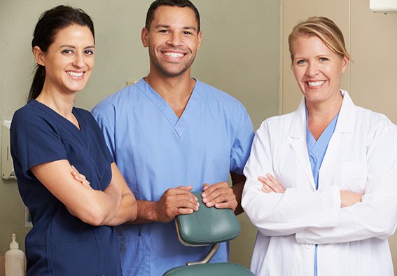 Team of dental professionals smiling