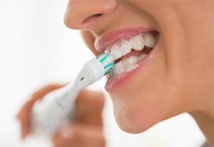 Woman brushing her teeth 