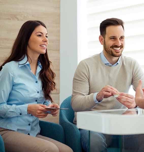 Couple consults with dentist