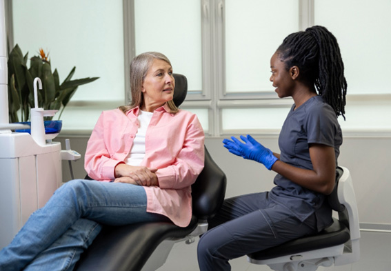 Patient and dental team member talking during consultation