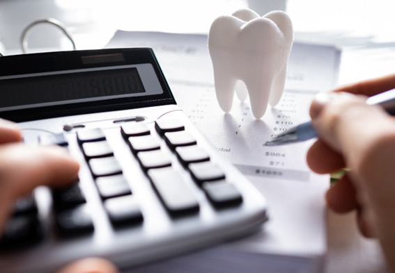 Person budgeting for the cost of dental care