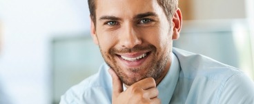 Man with healthy smile after periodontal therapy