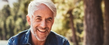 Older man with healthy smile thanks to restorative dentistry