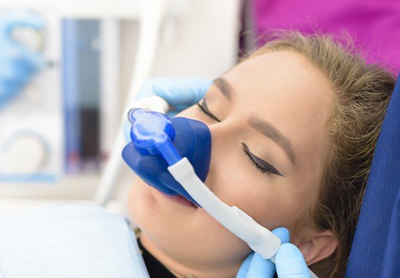 Woman with nitrous oxide nasal mask