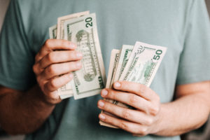 Man counting money for sleep apnea therapy