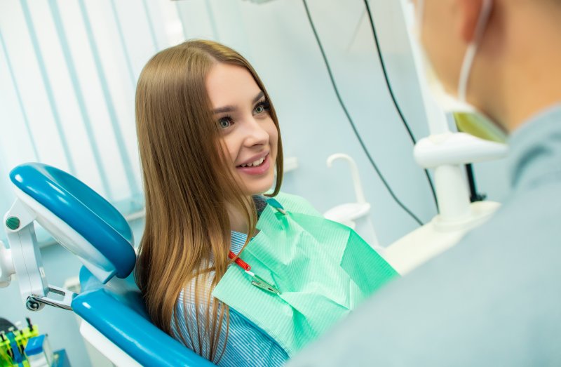 Patient smiling after dental implant surgery