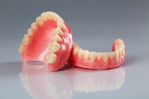 A pair of dentures on a shiny surface